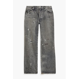 Distressed painted denim jeans