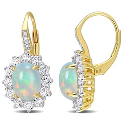 1 3/4 ct tgw oval shape blue ethiopian opal and white topaz and diamond accent halo leverback earrings in yellow plated sterling silver