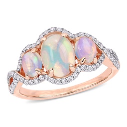 ethiopian blue opal and 1/3 ct tw diamond 3-stone halo twist ring in 10k rose gold