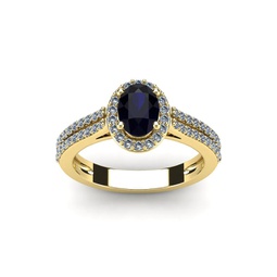 1 1/2 carat oval shape sapphire and halo diamond ring in 14 karat yellow gold
