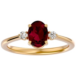 1.65 carat oval shape ruby and two diamond ring in 14 karat yellow gold