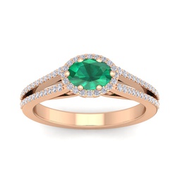 1 1/4 carat oval shape antique emerald and halo diamond ring in 14 karat rose gold