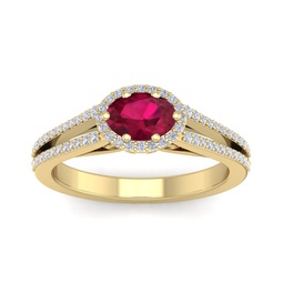 1 1/3 carat oval shape antique ruby and halo diamond ring in 14 karat yellow gold