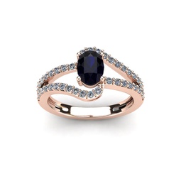 1 1/2 carat oval shape sapphire and fancy diamond ring in 14 karat rose gold