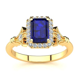 1 1/2 carat sapphire and halo diamond vintage ring in 14 karat yellow gold