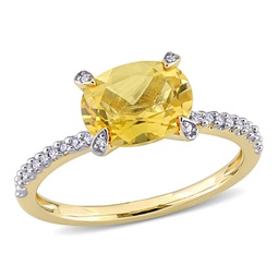 1 5/8 ct tgw oval-cut citrine and 1/10 ct tw diamond ring in 10k yellow gold